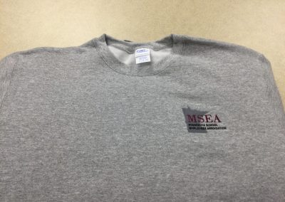 Light grey crewneck sweatshirt with MSEA logo